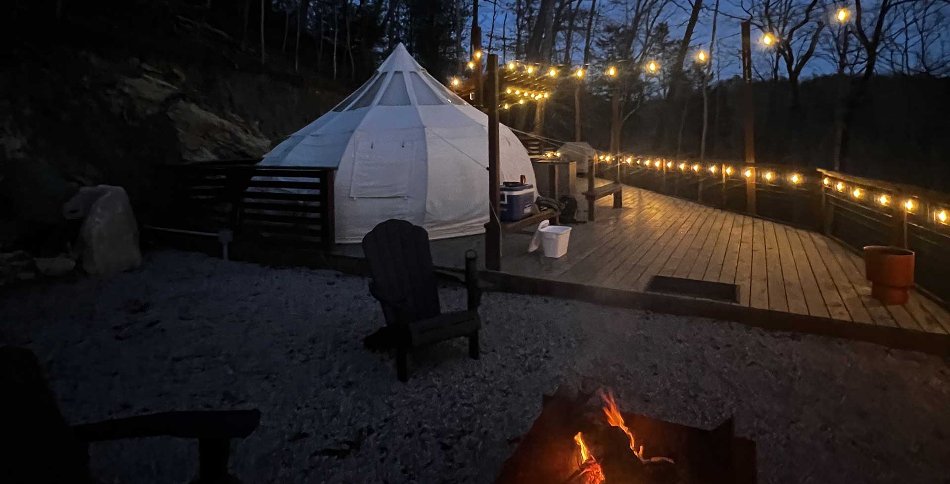 night shot with fire and string lights